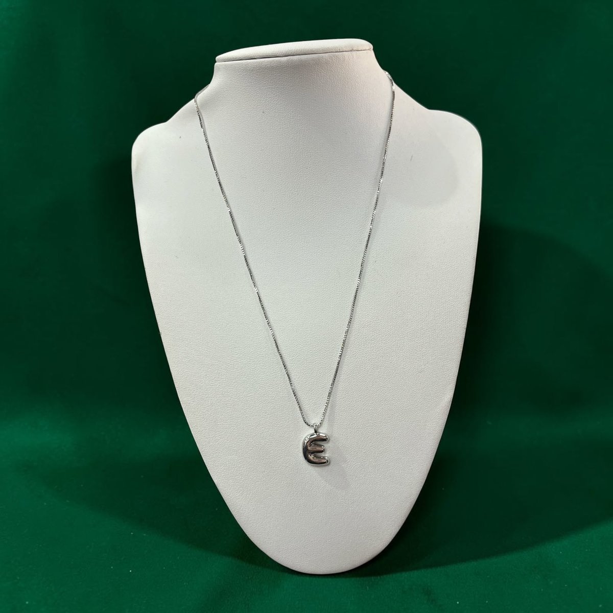 COLLAR "E" BRONCE