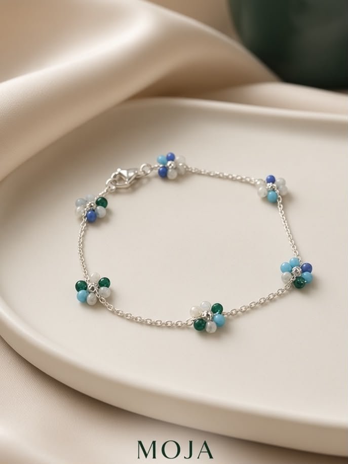 PULSERA FLORES ACERO BLANCO
